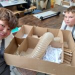 pupils sit alongside their gerbil maze creation